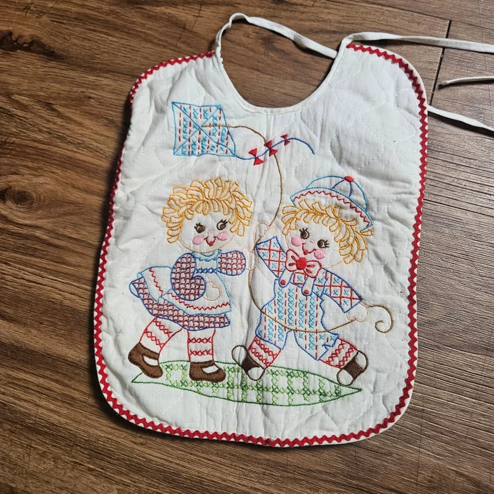 Lot of 2 Vintage Quilted Baby Bibs Embroidered Raggedy Ann Kite Swing Ric Rac